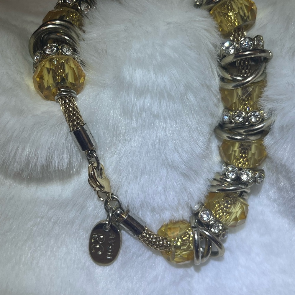 AVON gold tone, silver tone, and clear rhinestone slider bracelet